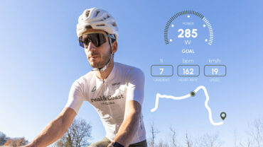 Cyclist riding with training data overlay during a Peak&Coast cycling plan