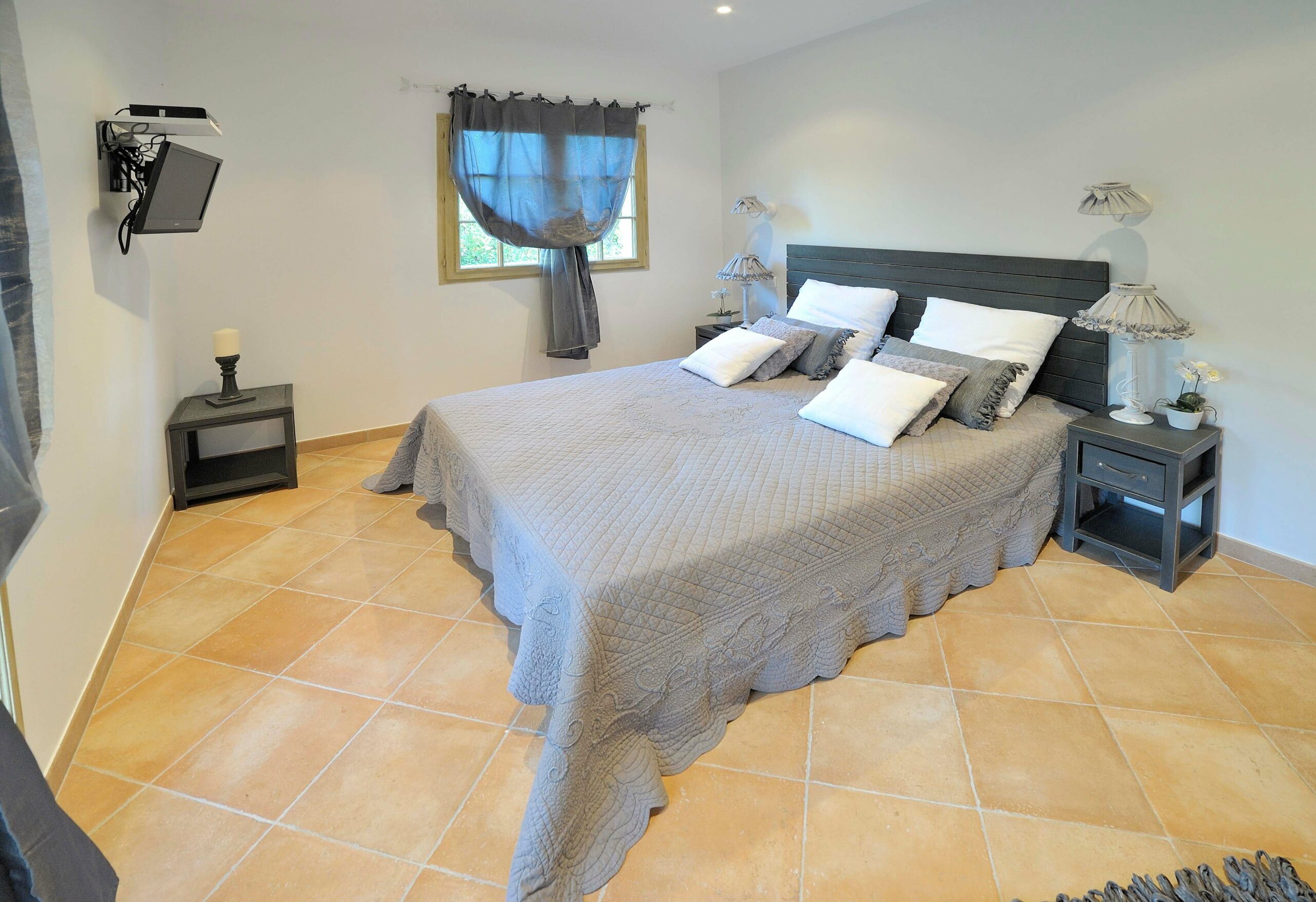 Comfortable villa bedroom in Corsica for a bike tour